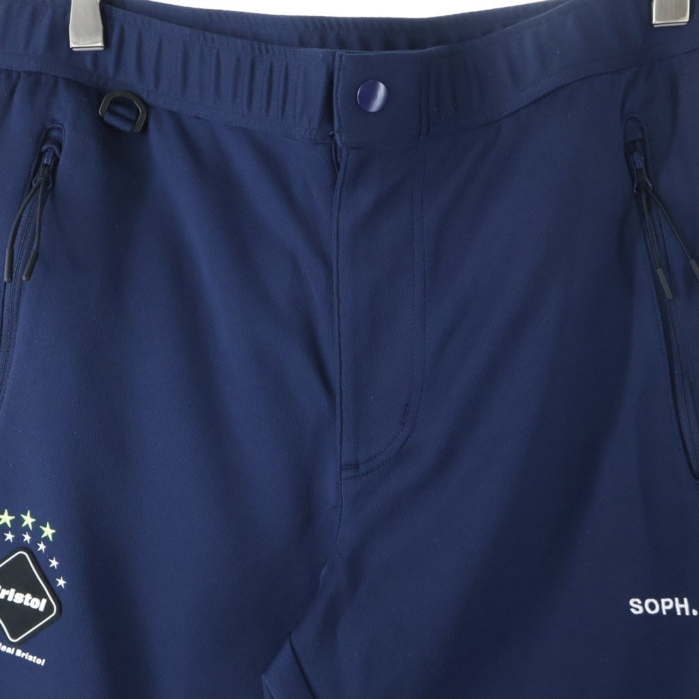 F.C.R.B./F.C.Real Bristol/FCRB(エフシーアールビー/エフシーレアルブリストル) PDK LONG PANTS ロゴパッチ付きサイドライントラックパンツ ネイビー/レッド FCRB-170005