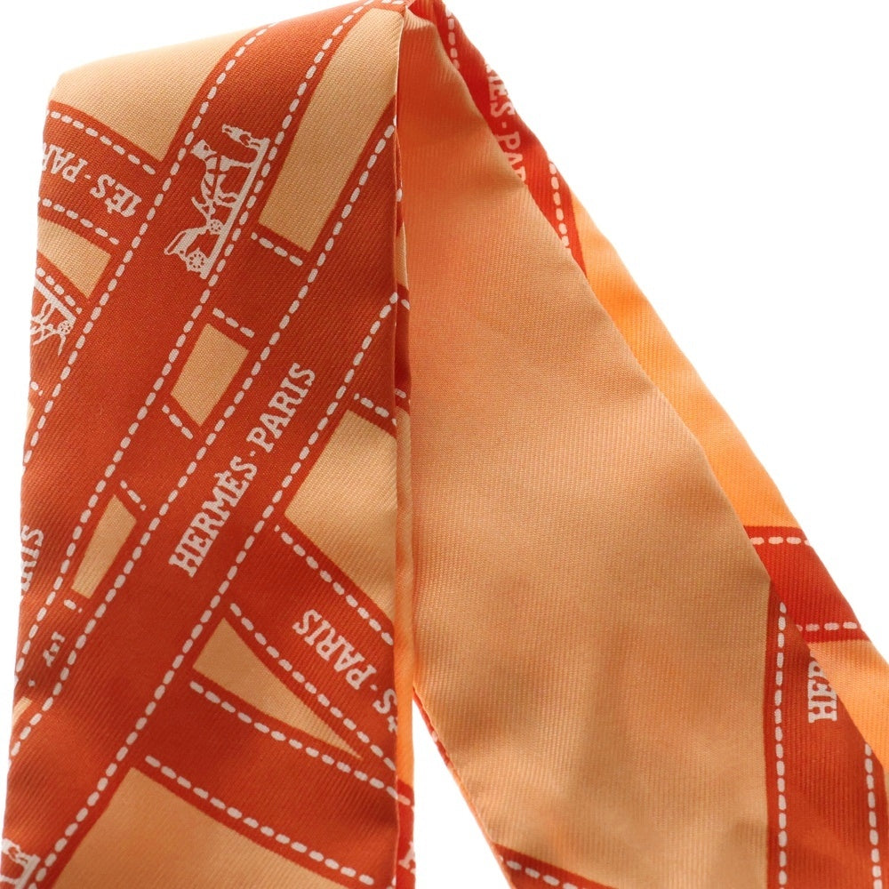 HERMES(エルメス) ツイリー ボルデュック ロゴ 総柄プリント シルク スカーフ オレンジ