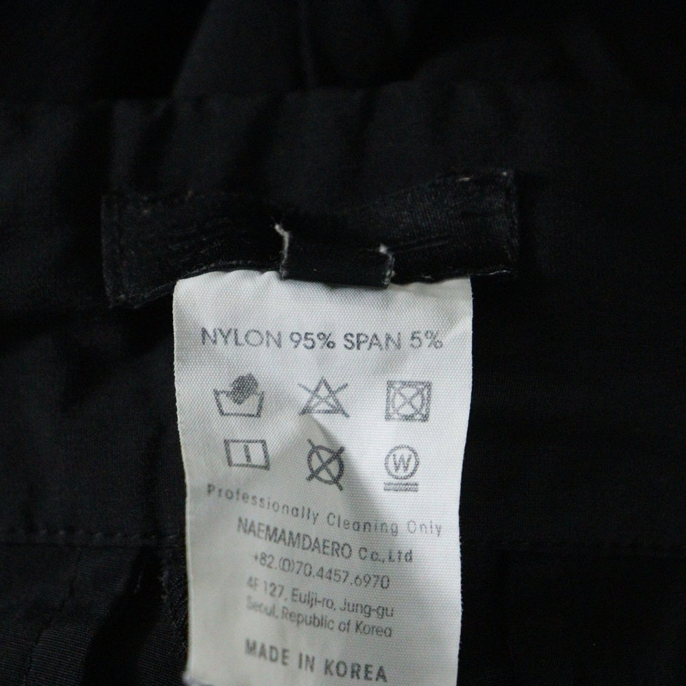 99%is(ナインティナインパーセントイズ) ナイロンジップ バックルトラックパンツ ブラック