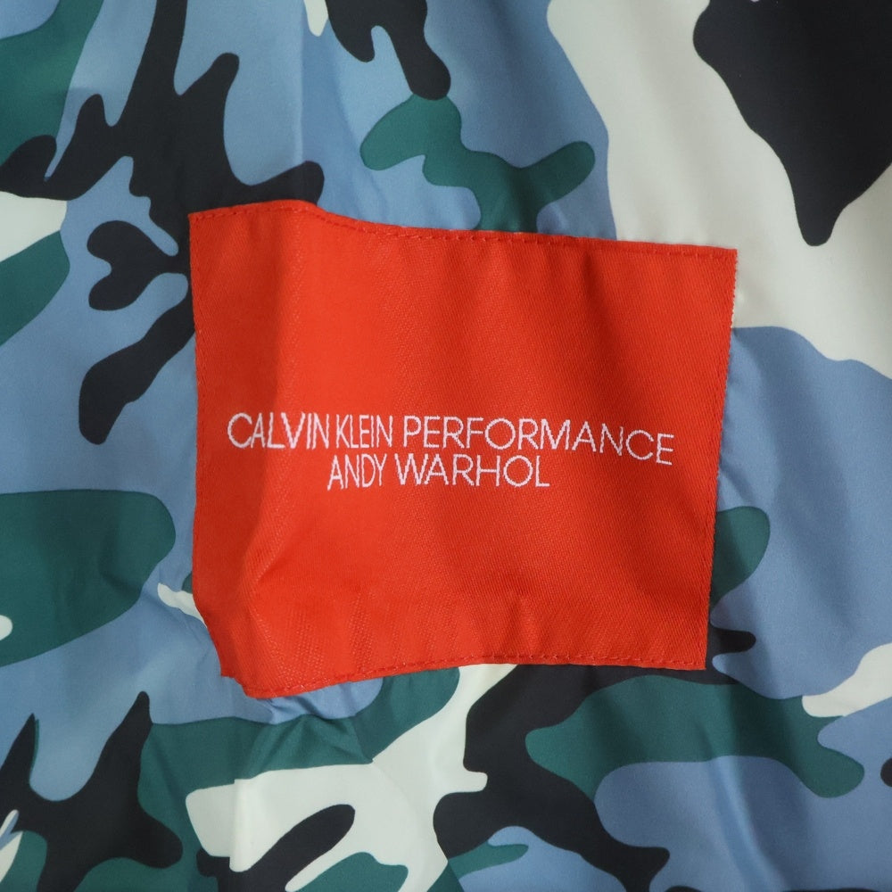 Calvin Klein(カルバンクライン) PERFORMANCE ANDY WARHOL パフォーマンス アンディーウォーホル カモ柄ポンチョ レインコート グリーン