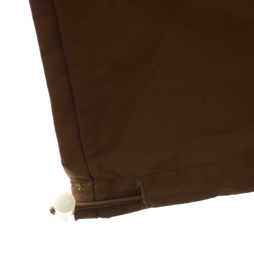FEAR OF GOD ESSENTIALS(フィアオブゴッド エッセンシャルズ) NYLON PANTS リフレクターロゴ ナイロンパンツ ブラウン