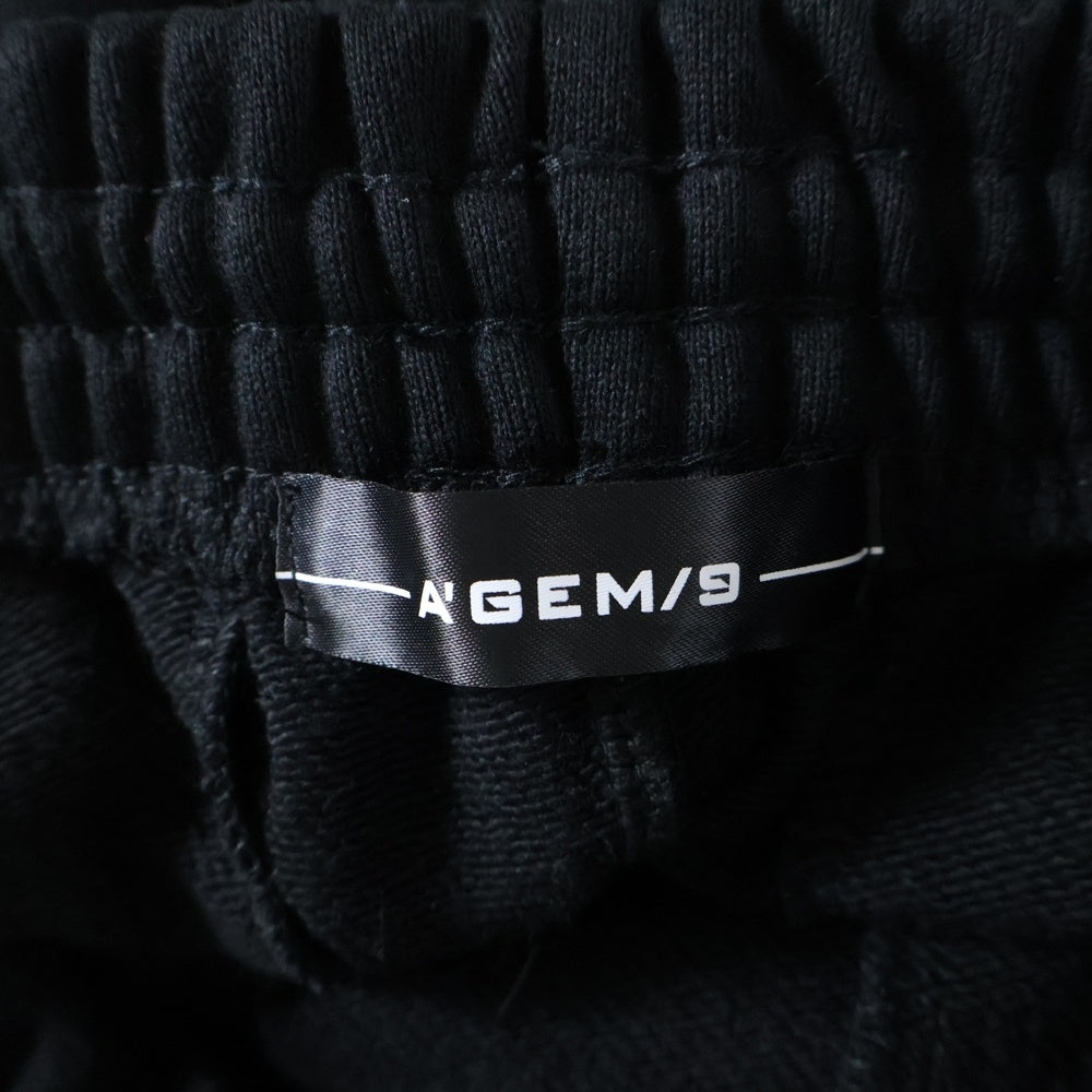 A'gem 9(エージェムナイン) 25SS ×.kom EMBROIDERY ANGEL HALF PT エンジェルエンブロイダリーロゴ ショーツ ハーフパンツ ブラック AGN25-C04