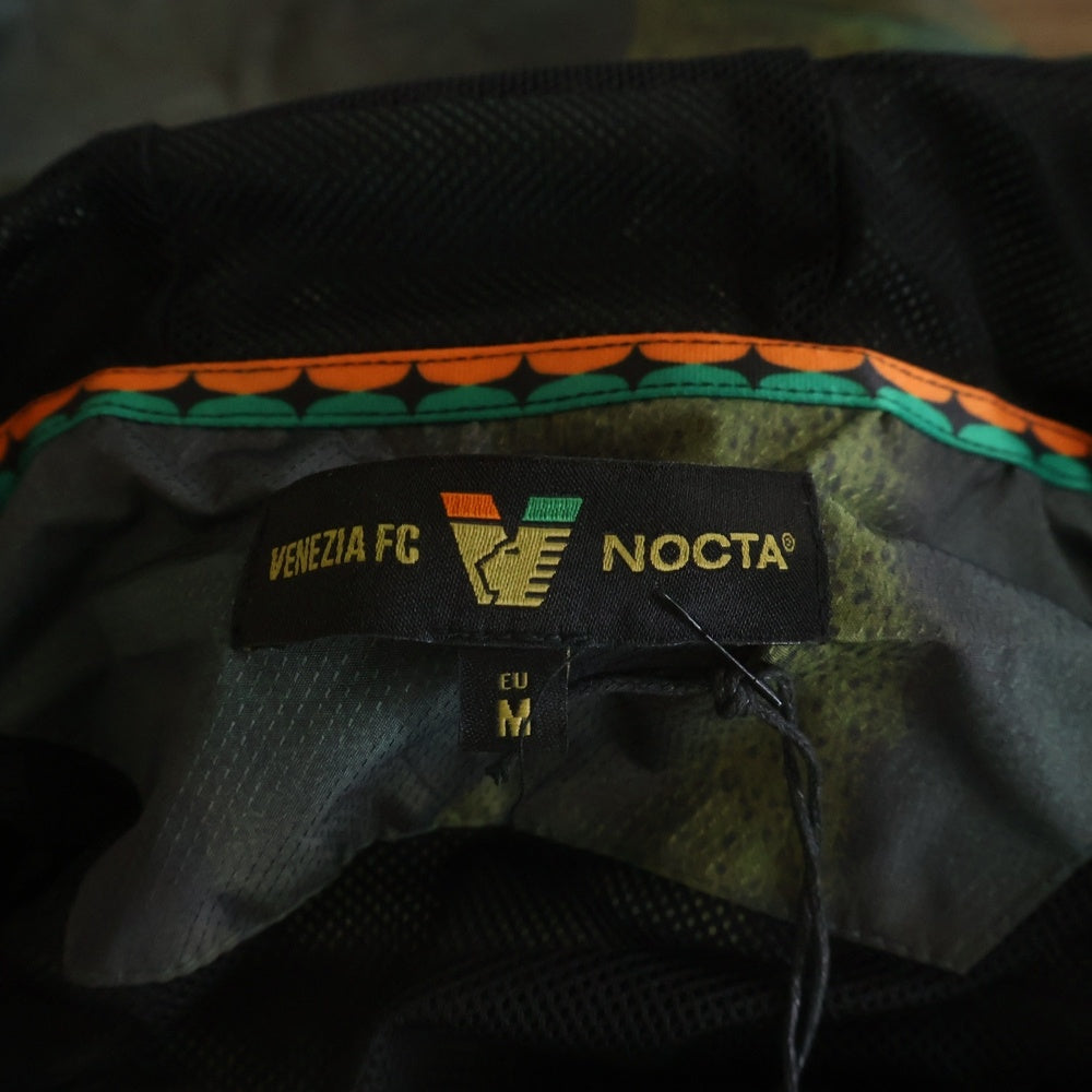 NO BRAND(ノーブランド) NOCTA × VENEZIA FC ノクタ × ヴィゼル Lion Camo Rain Jacket カモフラ ナイロン トラックジャケット カーキ