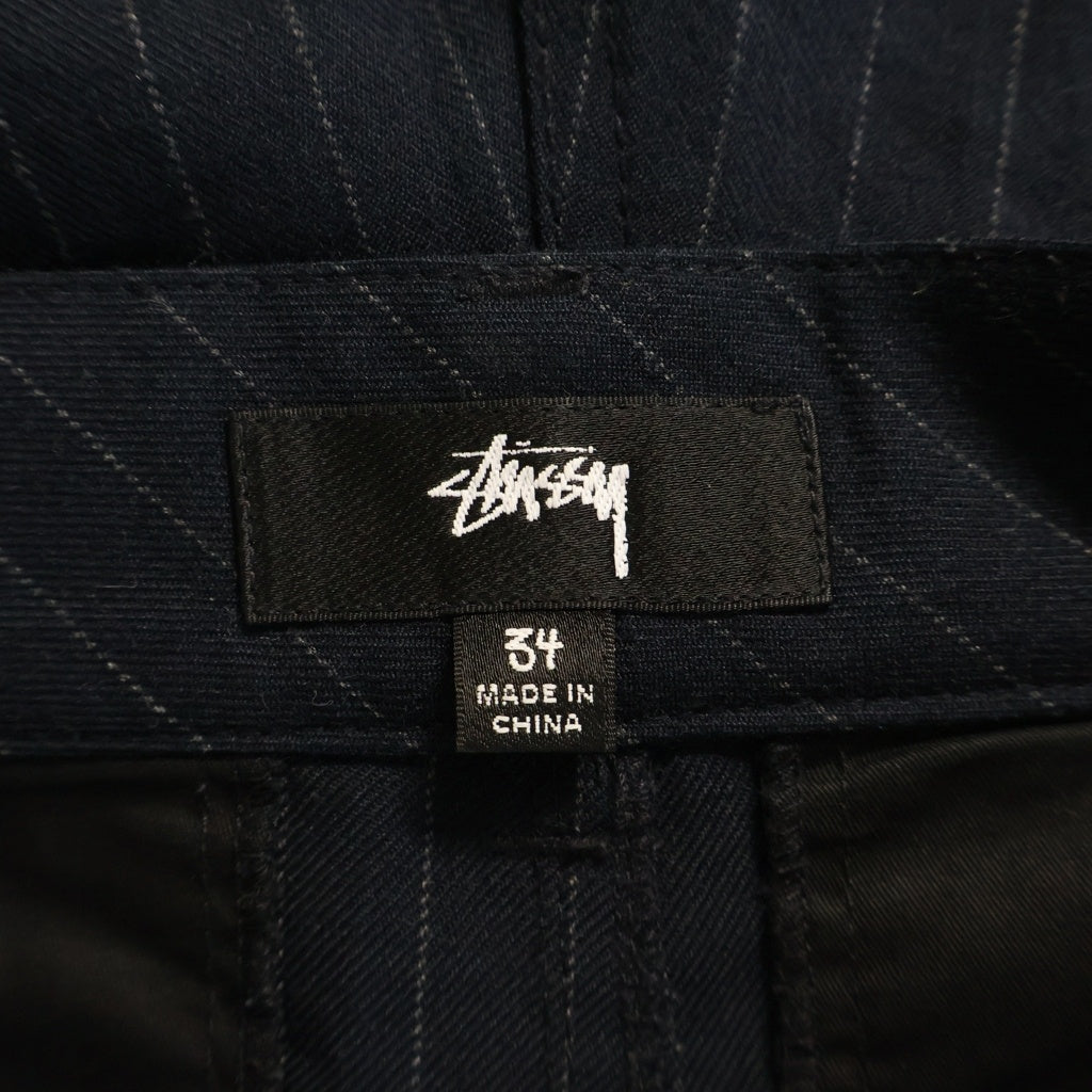 STUSSY(ステューシー) VOLUME PLEATED SHORT STRIPE ボリュームプリーツショートストライプパンツ ネイビー 112312