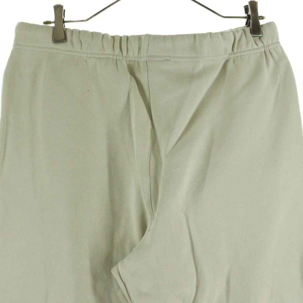 FEAR OF GOD ESSENTIALS(フィアオブゴッド エッセンシャルズ) ラバーロゴ ドローコード フリース スウェットパンツ アイボリー