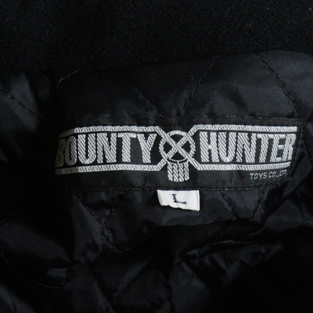 BOUNTY HUNTER(バウンティーハンター) スカルロゴ刺繍 スナップボタン バーシティージャケット ブラック