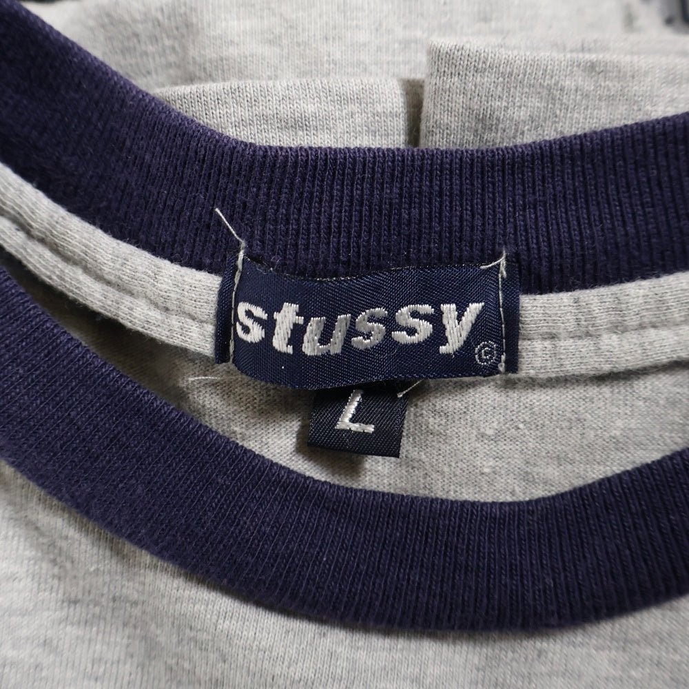 STUSSY(ステューシー) 90s OLD STUSSY オールドステューシー 紺タグ 聖火ロゴ フロント刺繍 クルーネック ラグランスリーブ リンガー 半袖Tシャツ カットソー グレー