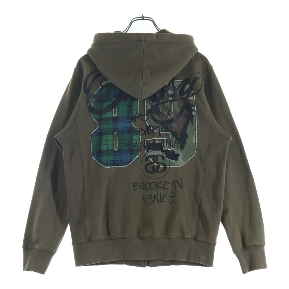 STUSSY(ステューシー) World Tour ストックロゴ 両面プリント 切替 ジップアップパーカー フーディー カーキ