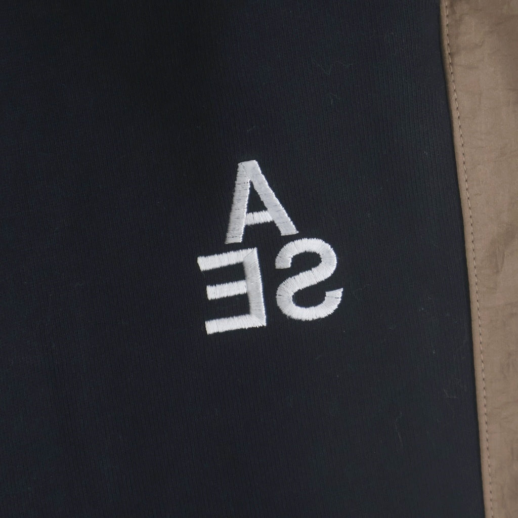 WIND AND SEA(ウィンダンシー) SWEAT TRUCK PANTS ロゴ刺繍 ナイロン トラックパンツ ブラックブラウン WDS-20A-PT-02