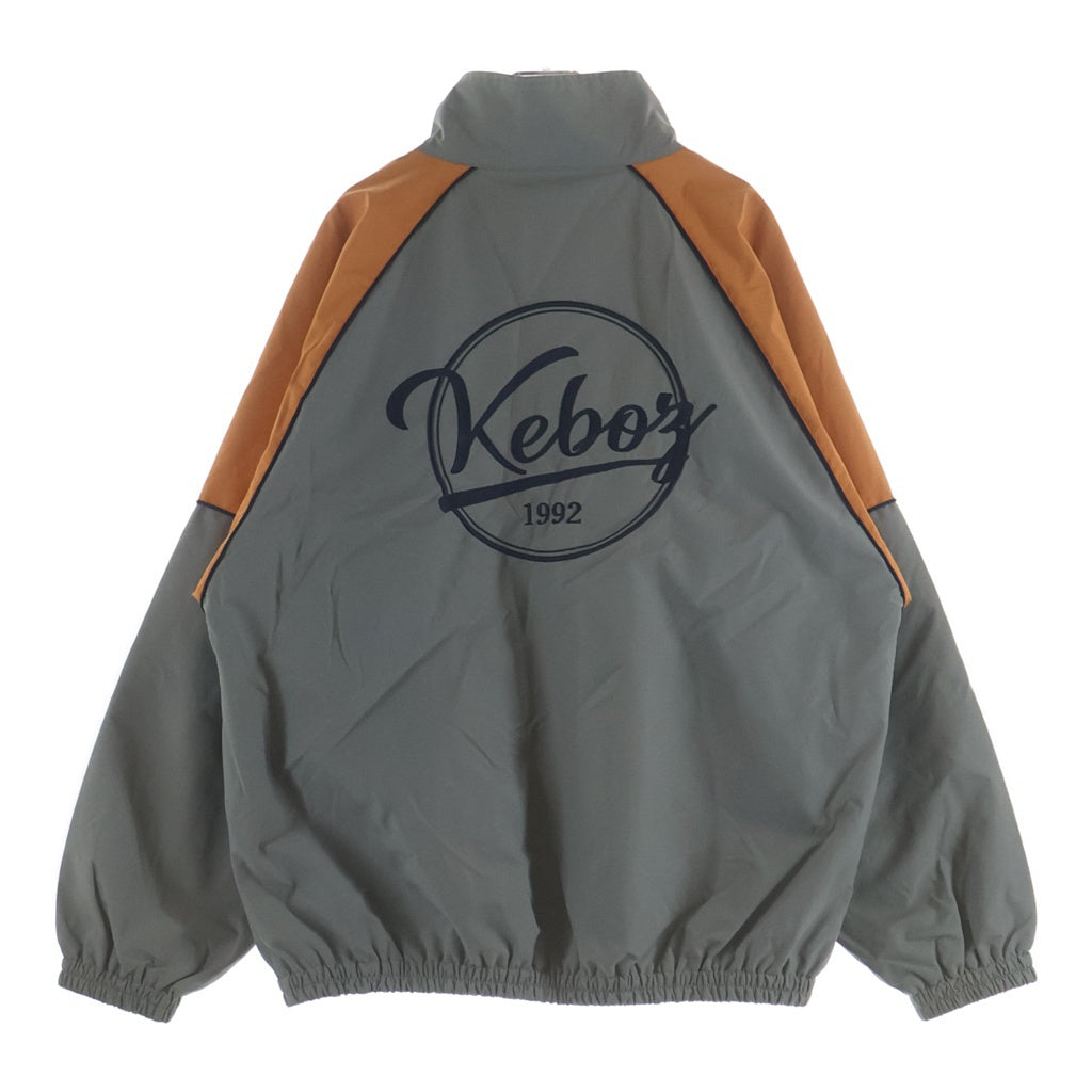 KEBOZ(ケボズ) 2TONE TRACK JACKET ロゴ刺繍 ツートーン ジップアップ ナイロン トラックジャケット グレー/オレンジ