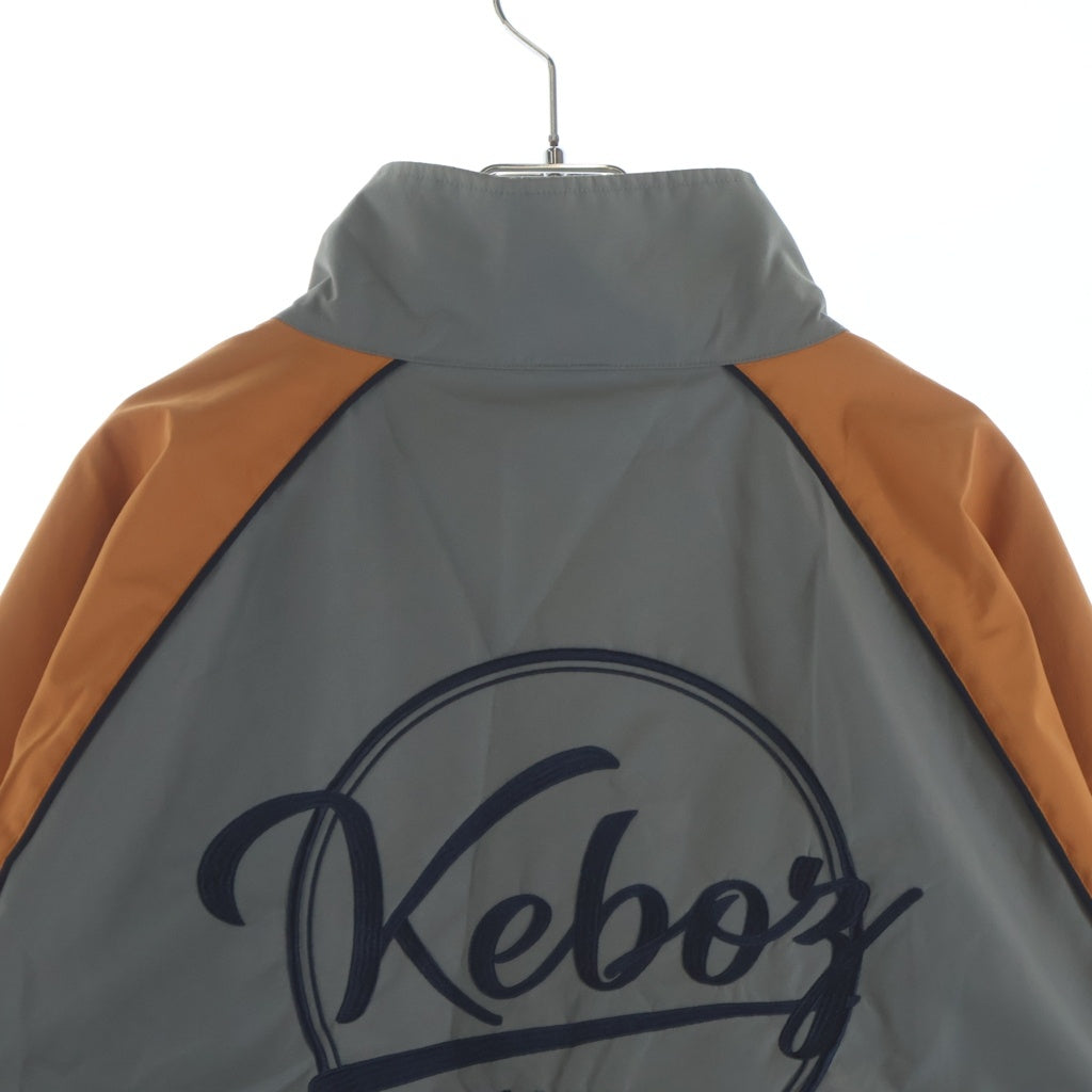 KEBOZ(ケボズ) 2TONE TRACK JACKET ロゴ刺繍 ツートーン ジップアップ ナイロン トラックジャケット グレー/オレンジ