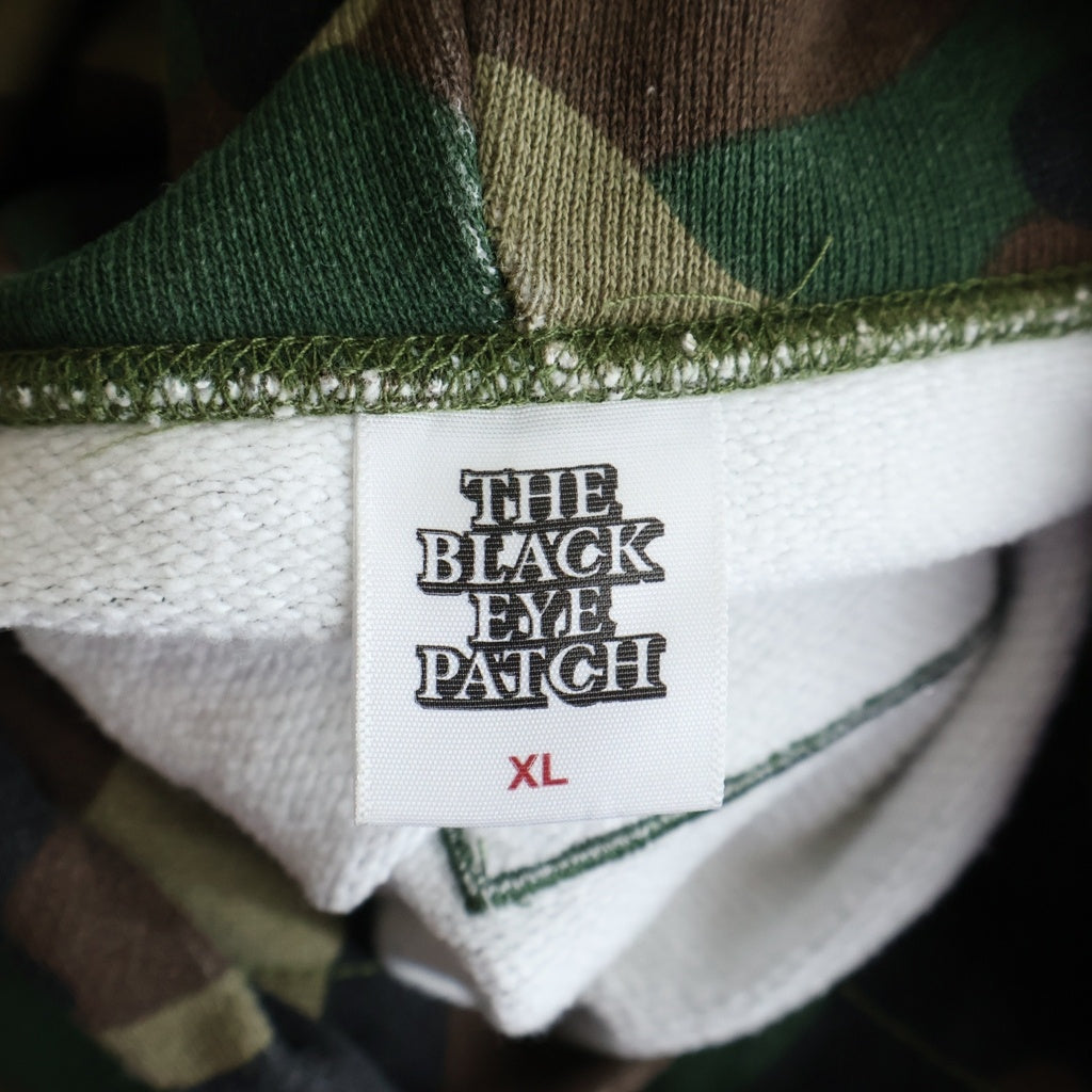 THE BLACK EYE PATCH(ブラックアイパッチ) Camouflage HWC Label Hoodie カモフラージュ総柄 フロント取扱注意ロゴ 刺繍 プルオーバー パーカーフーディー マルチ