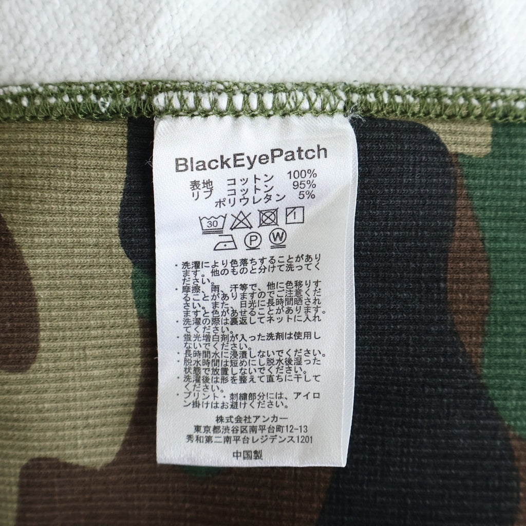 THE BLACK EYE PATCH(ブラックアイパッチ) Camouflage HWC Label Hoodie カモフラージュ総柄 フロント取扱注意ロゴ 刺繍 プルオーバー パーカーフーディー マルチ