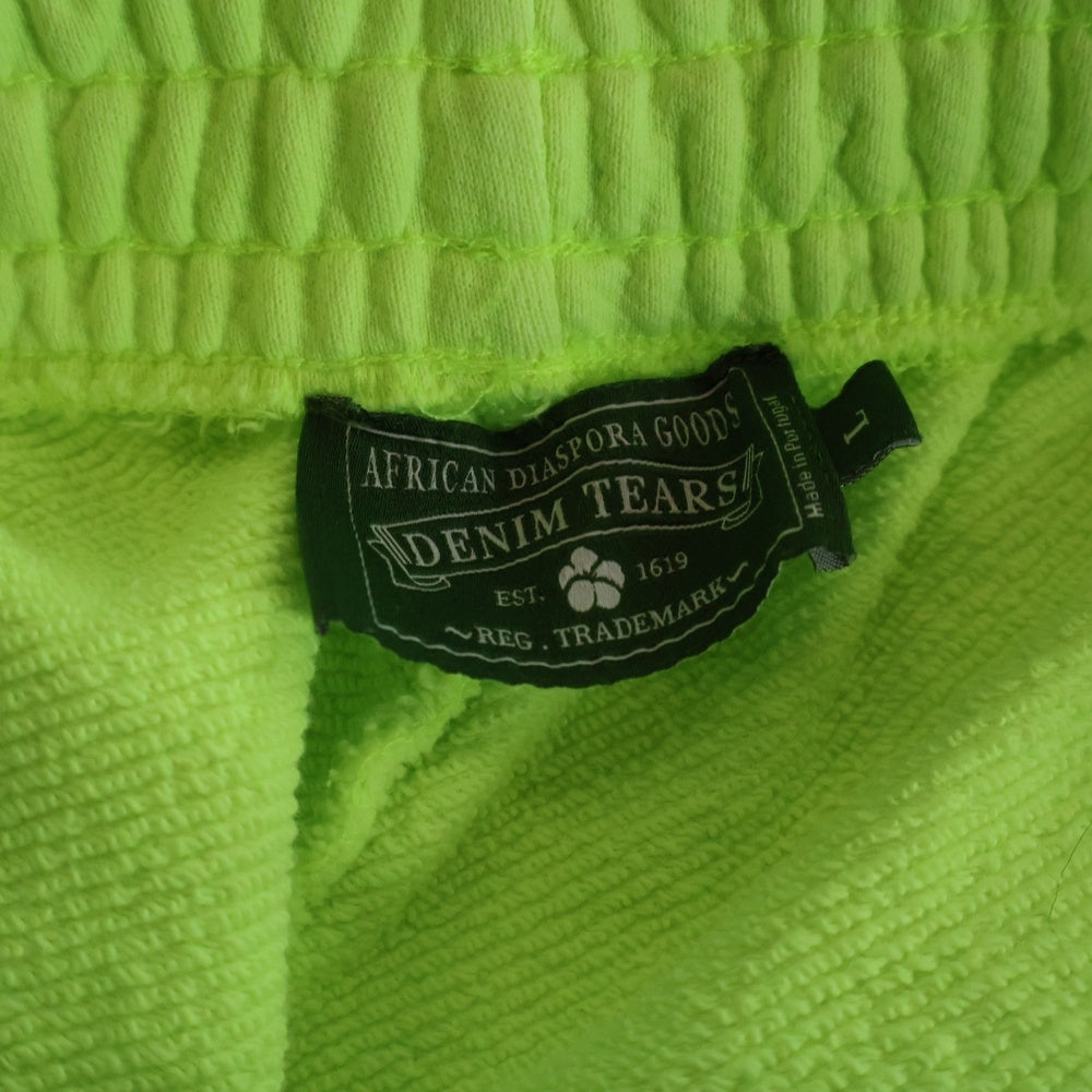 DENIM TEARS(デニムティアーズ) MONO COTTON WREATH SWEAT PANTS NEON モノ コットン スウェットパンツ ネオンイエロー