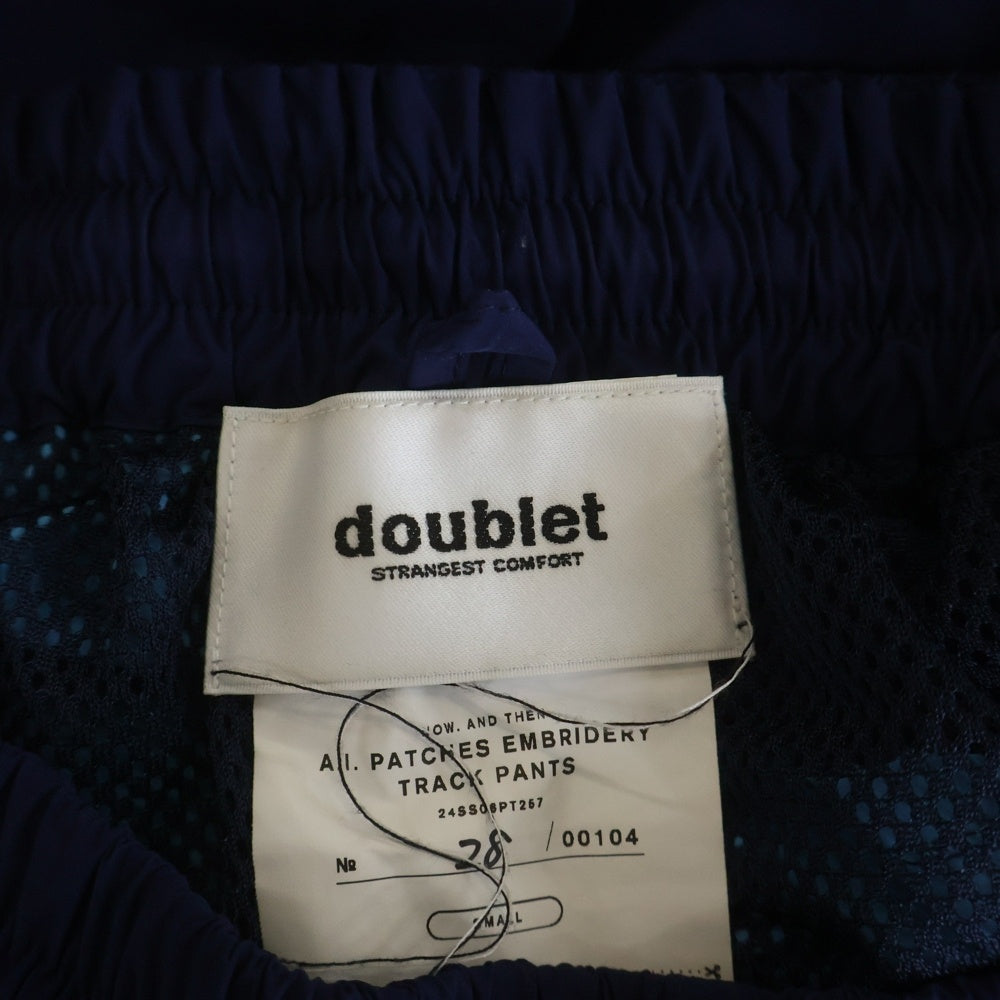 doublet(ダブレット) 24SS A.I. PATCHES EMBRIDERY TRACK PANTS パッチ付き トラックパンツ ブルー 24SS06PT257