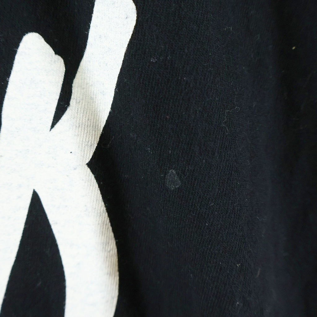 BLACK COMME des GARCONS(ブラックコムデギャルソン) メッセージプリントリングスリーブカットソー 1Q-T001 ブラック