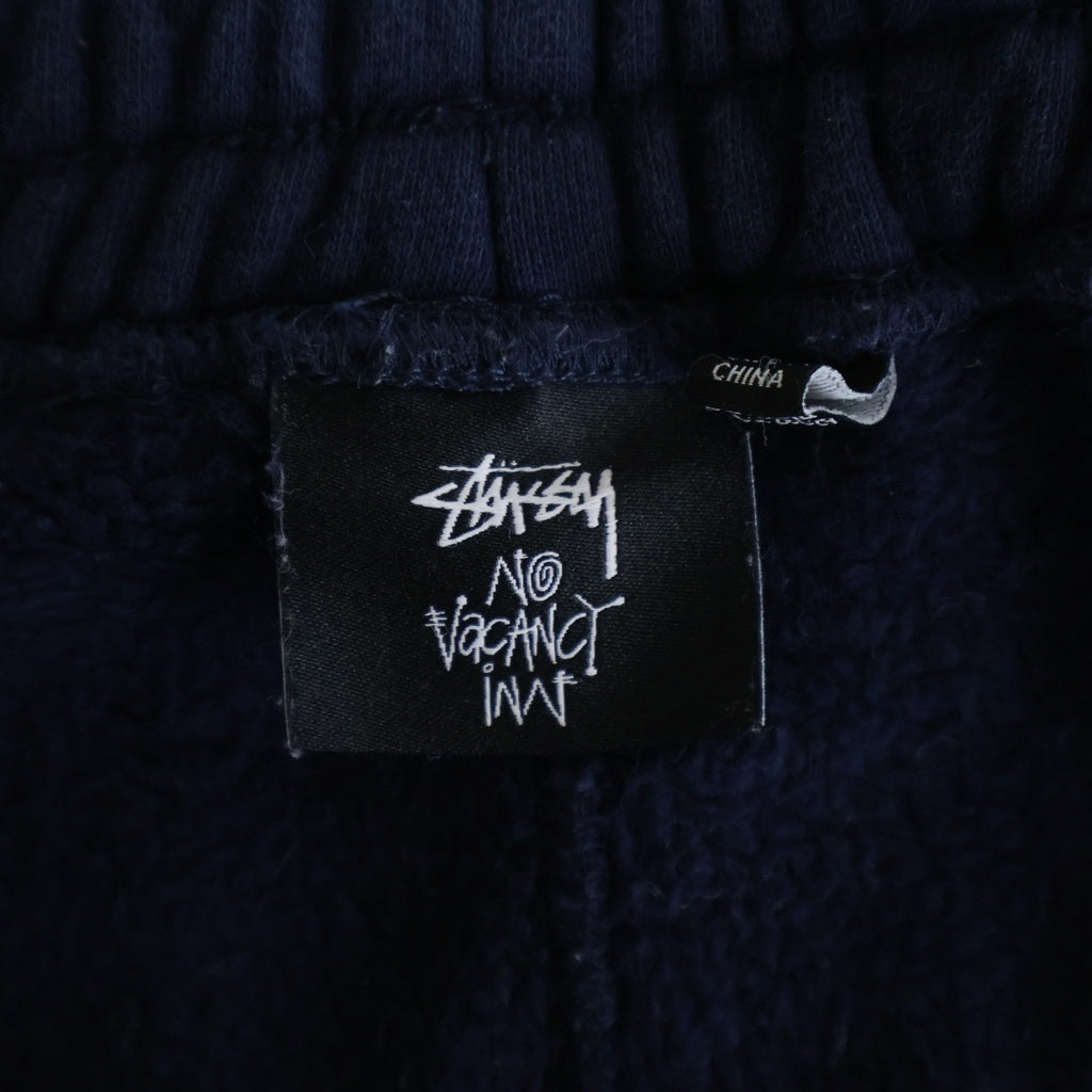 STUSSY(ステューシー) ×No Vacancy Inn Fleece Pant ノーバカンシー インフリーススウェットパンツ ネイビー