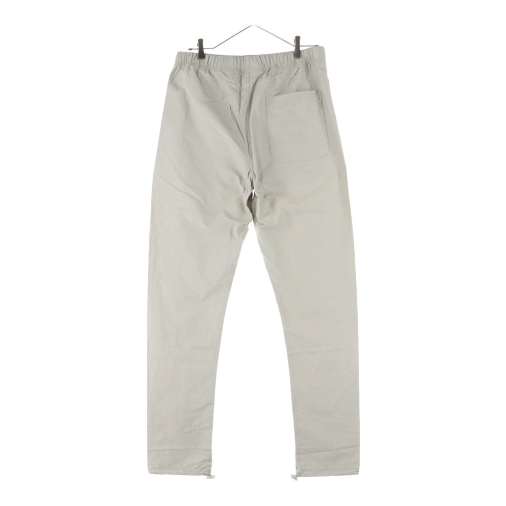 ESSENTIALS FEAR OF GOD(エッセンシャル フィアオブゴッド) NYLON TRACK PANTS ラバーロゴ ナイロントラックパンツ グレー