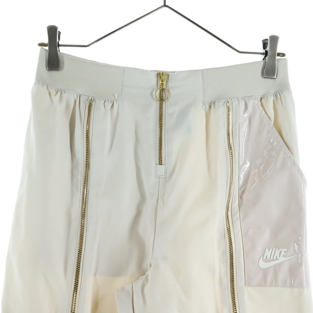 NIKE(ナイキ) アイコンクラッシュ ウインドブレーカー パンツ トレーニングパンツ CU6926-104 ベージュ レディース