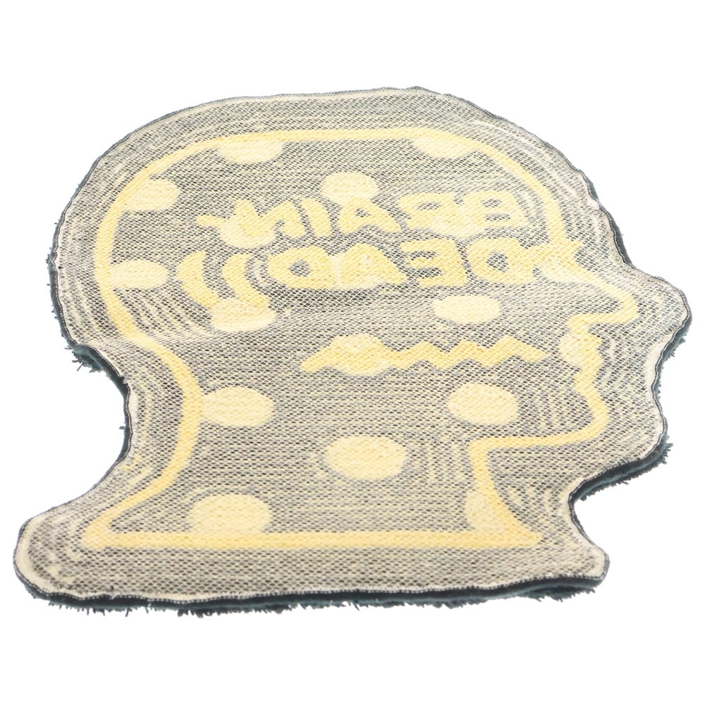 BRAIN-DEAD(ブレインデッド) LOGO HEAD RUG ロゴヘッドラグマット ブラック/イエロー