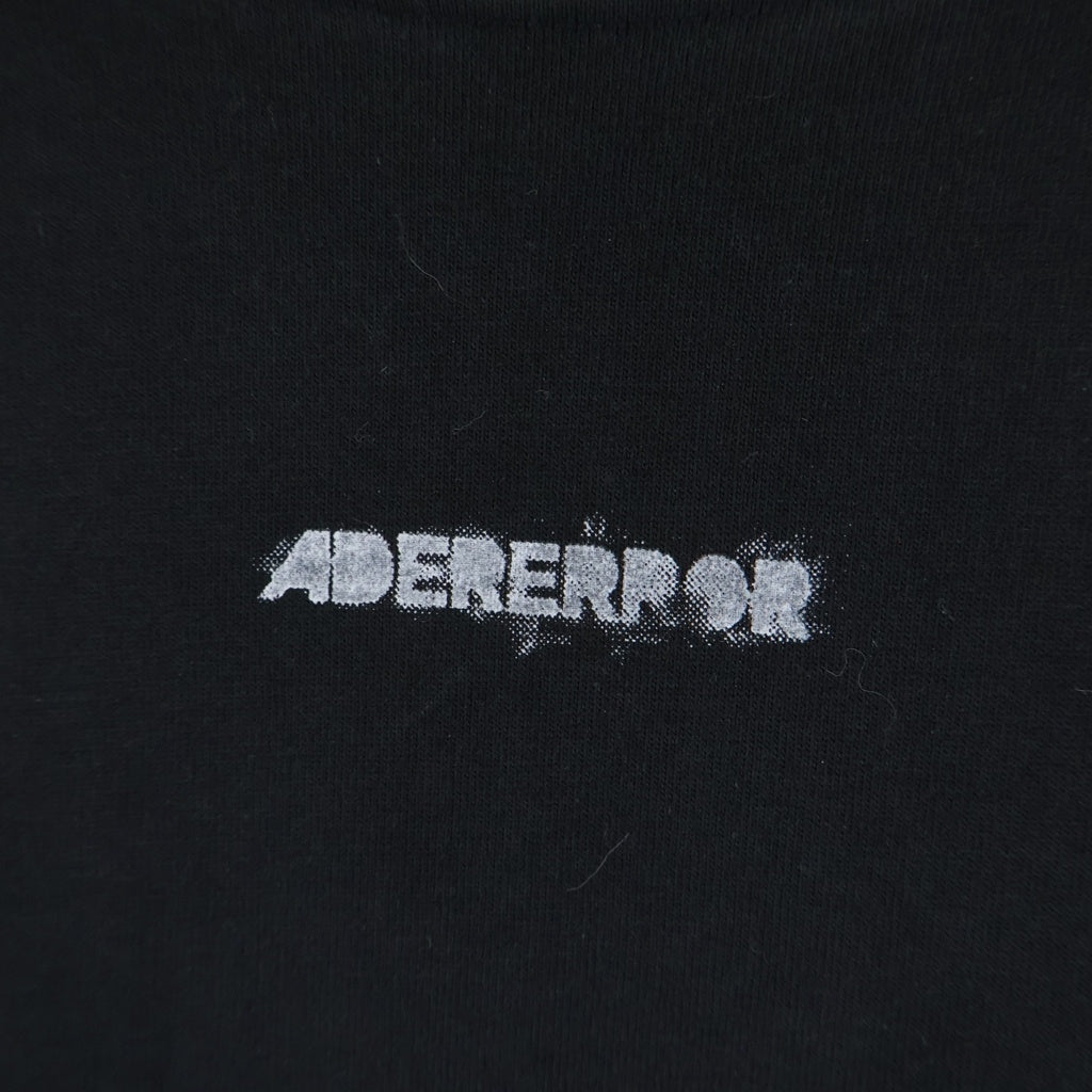 ADER ERROR(アーダーエラー) Obe Long Sleeve バックペイントロゴ エルボーオープン クルーネック 長袖Tシャツ カットソー ブラック BLASSLT01BK1
