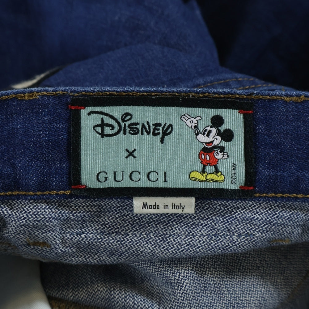 GUCCI(グッチ) ×Disney ミッキーマウス ワッペン 刺繍 レザーパッチ ボタンフライ テーパードデニムパンツ ジーンズ インディゴ 408637