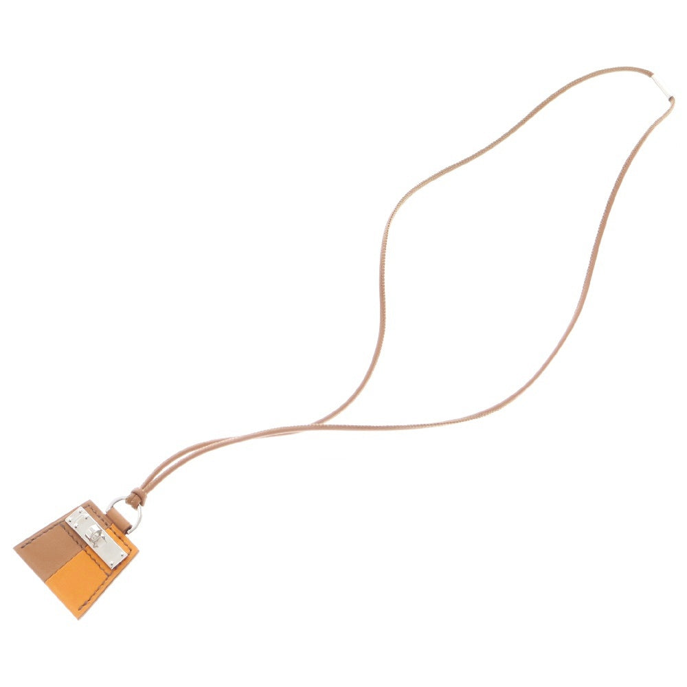 HERMES(エルメス) モンプティケリーPM ネックレス ゴールド×オレンジ スイフト シルバー金具 チャーム アクセサリー