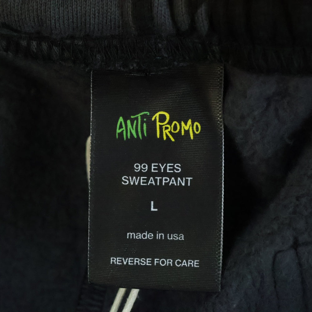 ANTI PROMO(アンチプロモ) 99EYES SWATPANTS MATTY BOY プリントスウェットロングパンツ ブラック