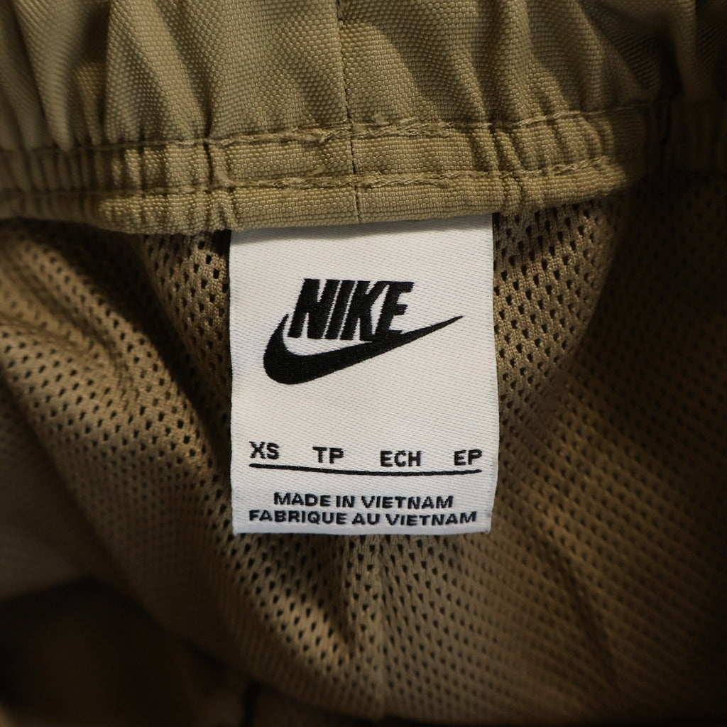 STUSSY(ステューシー) ×NIKE Utility Pant Pine Nut ロゴ 刺繍 ナイロン サイド ライン ジップ パンツ ベージュ