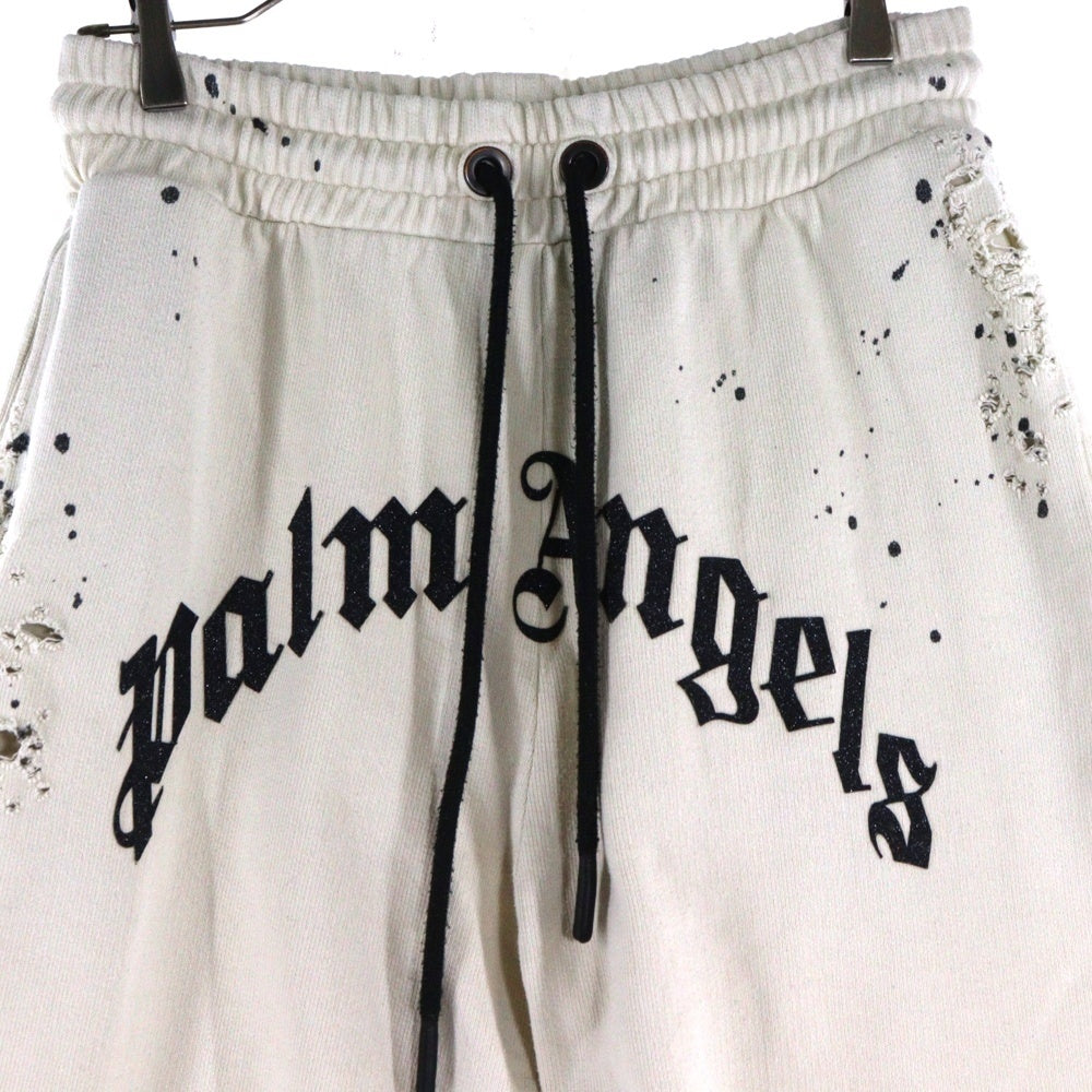 Palm Angels(パームエンジェルス) 25AW GLITTERED LOGO SWET PANTS グリッターロゴ ダメージ加工 スウェットパンツ アイボリー PMCH011F22FLE003