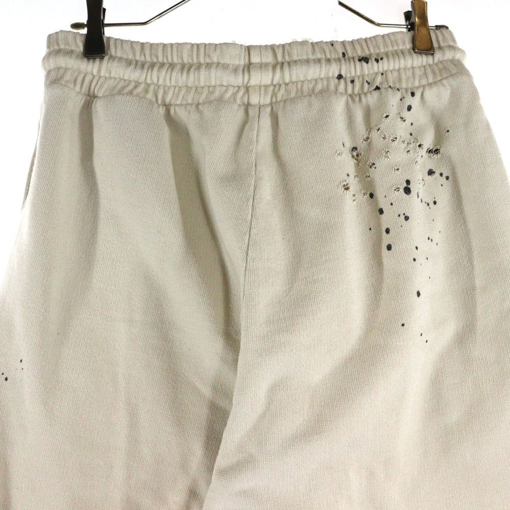 Palm Angels(パームエンジェルス) 25AW GLITTERED LOGO SWET PANTS グリッターロゴ ダメージ加工 スウェットパンツ アイボリー PMCH011F22FLE003