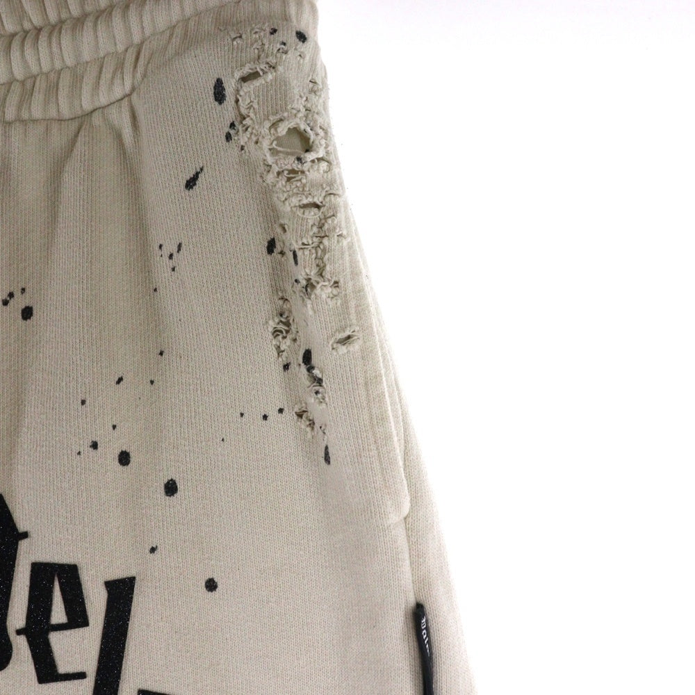 Palm Angels(パームエンジェルス) 25AW GLITTERED LOGO SWET PANTS グリッターロゴ ダメージ加工 スウェットパンツ アイボリー PMCH011F22FLE003