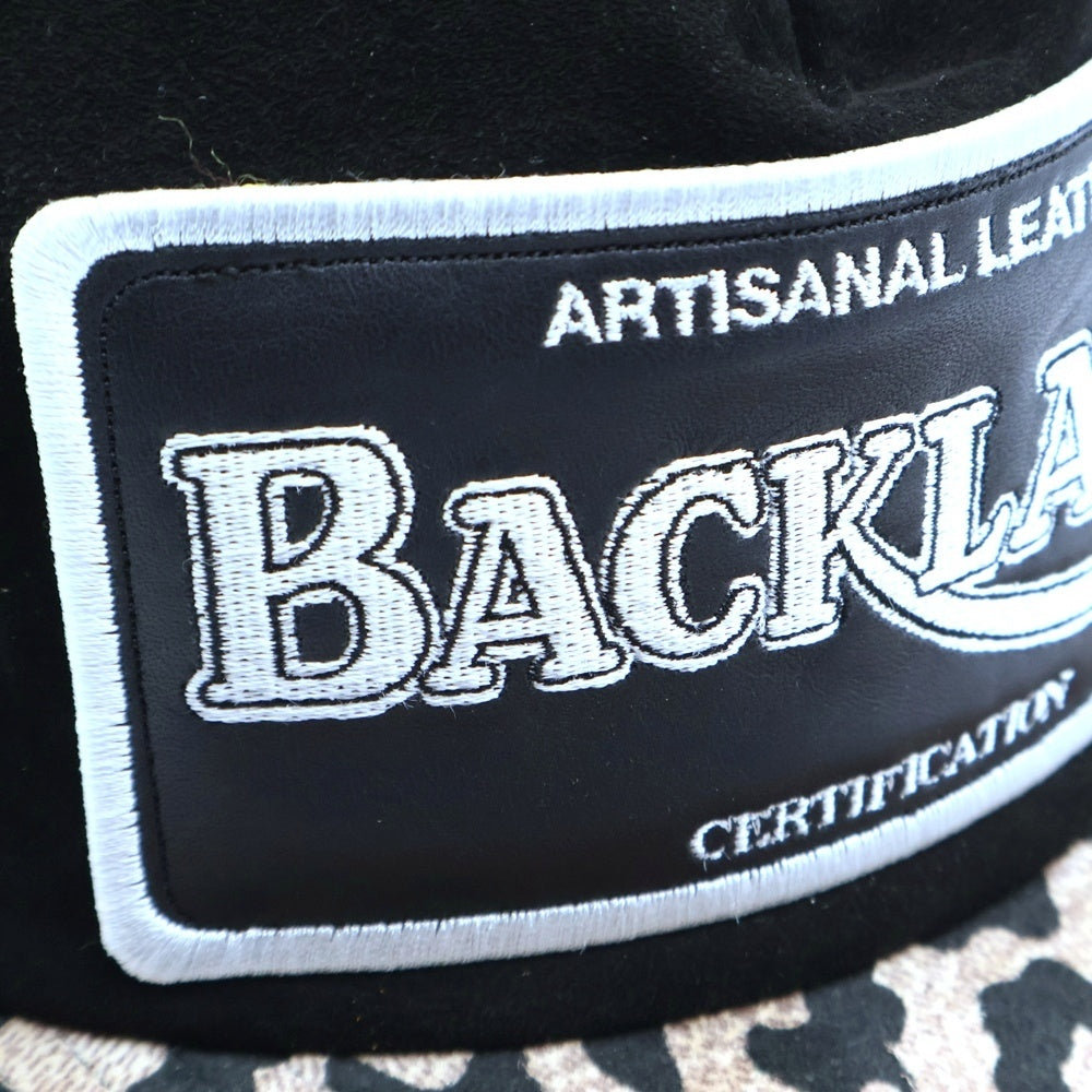 ISAMU KATAYAMA BACKLASH(イサムカタヤマバックラッシュ) 23SS KANGAROO SUEDE CAP レオパード柄 カンガルースウェード メッシュトラッカーキャップ ブラック/ブラウン 869-02