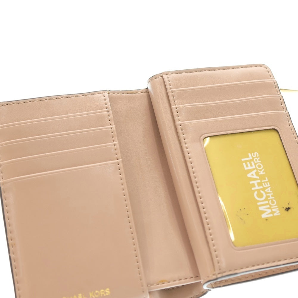 MICHAEL KORS(マイケルコース) GREENWICH ロゴプレート シグネチャー モノグラムキャンバス コンパクトウォレット 二つ折り財布 ピンク 32H1GGRE8B