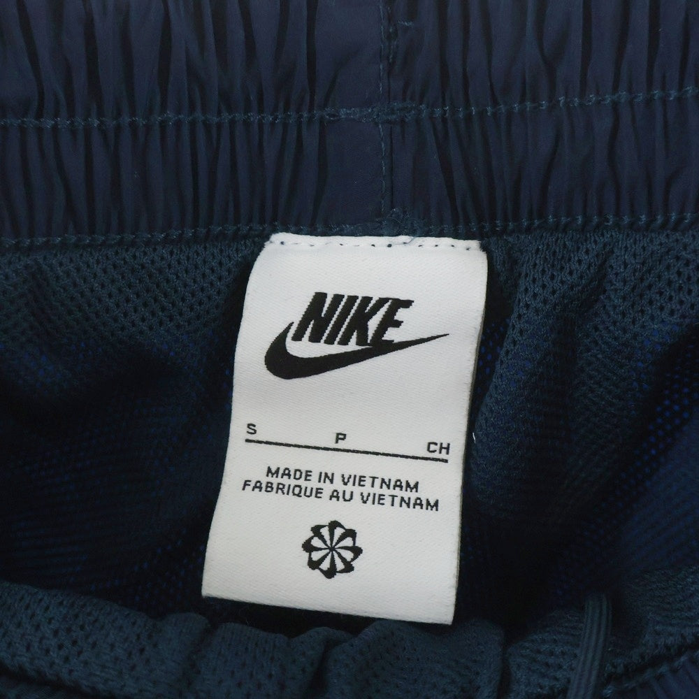 NIKE(ナイキ) LNSWESS OS ロゴ刺繍 ウーブン ナイロン ジョガーパンツ ネイビー レディース FV7669-478