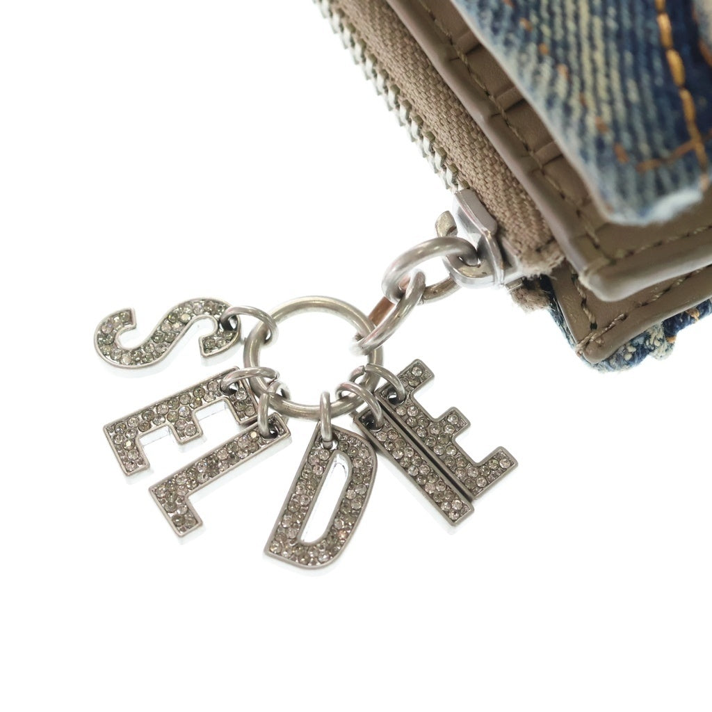 DIESEL(ディーゼル) CHARM D-BI FOLD ZIP レタリングチャーム キルティングデニム ミニウォレット 二つ折り財布 インディゴ X10116P5570 レディース