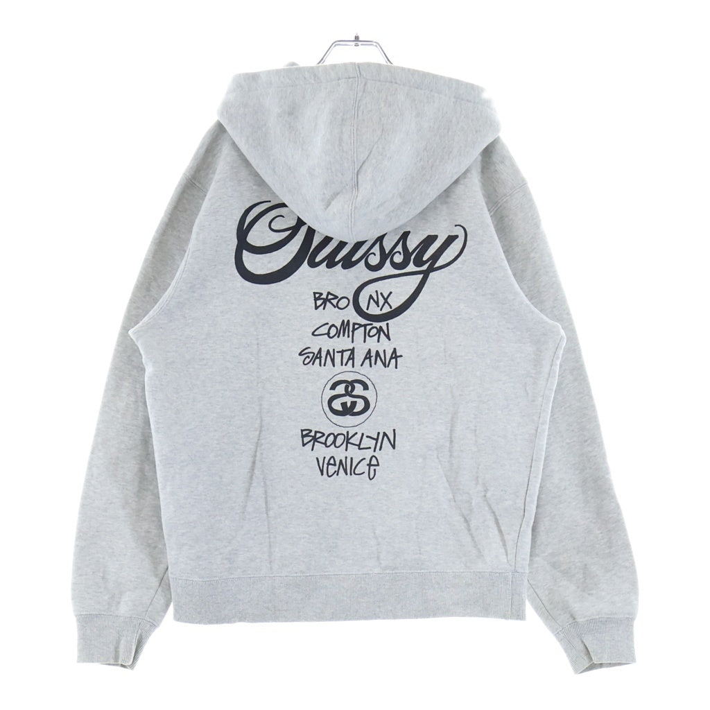 STUSSY(ステューシー) WORLD TOUR ZIP UP HOODIE ワールドツアー ジップアップ フーデッド パーカー グレー