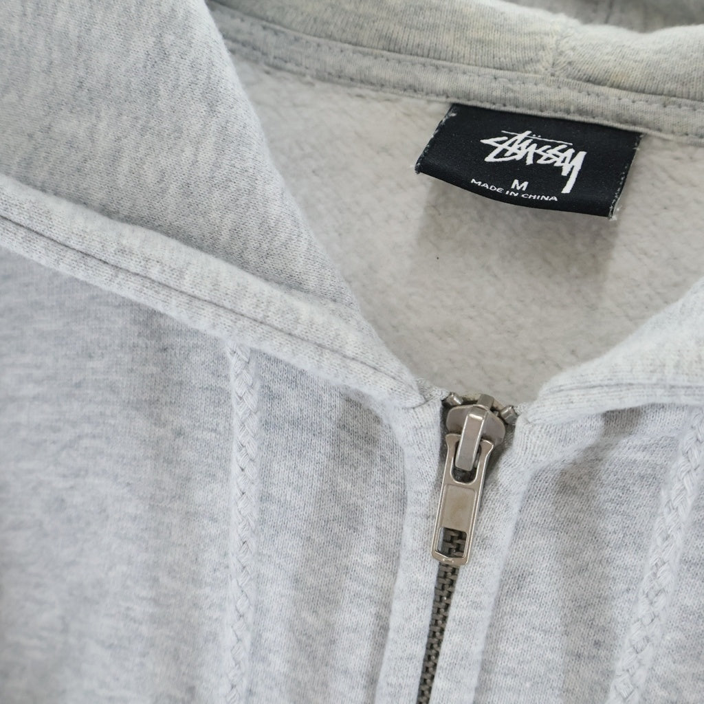 STUSSY(ステューシー) WORLD TOUR ZIP UP HOODIE ワールドツアー ジップアップ フーデッド パーカー グレー