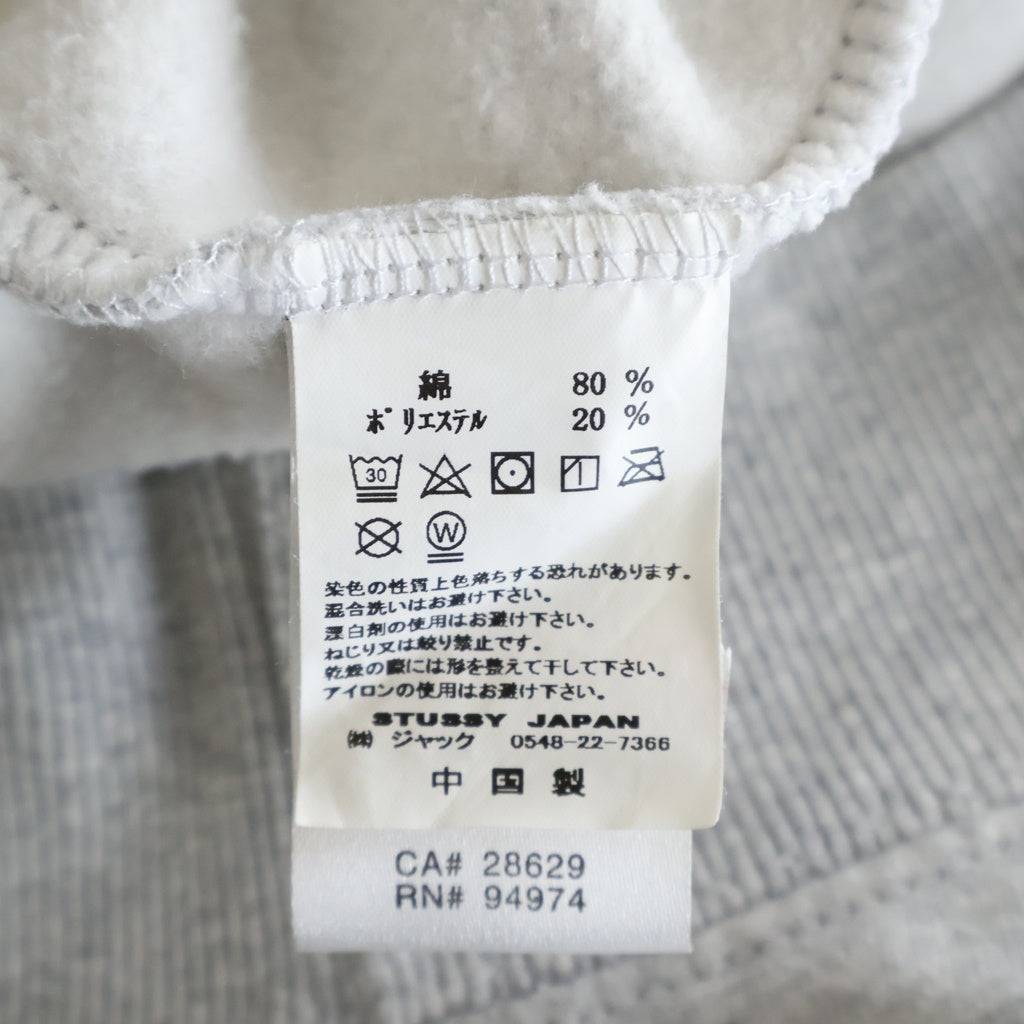 STUSSY(ステューシー) WORLD TOUR ZIP UP HOODIE ワールドツアー ジップアップ フーデッド パーカー グレー