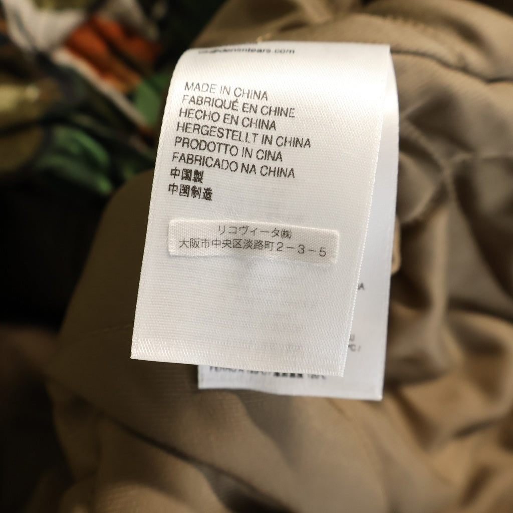 DENIM TEARS(デニムティアーズ) 26SS CAMO WORK JACKET カモ柄 ファーフーデッドワークジャケット カーキ SS26OLJ1356