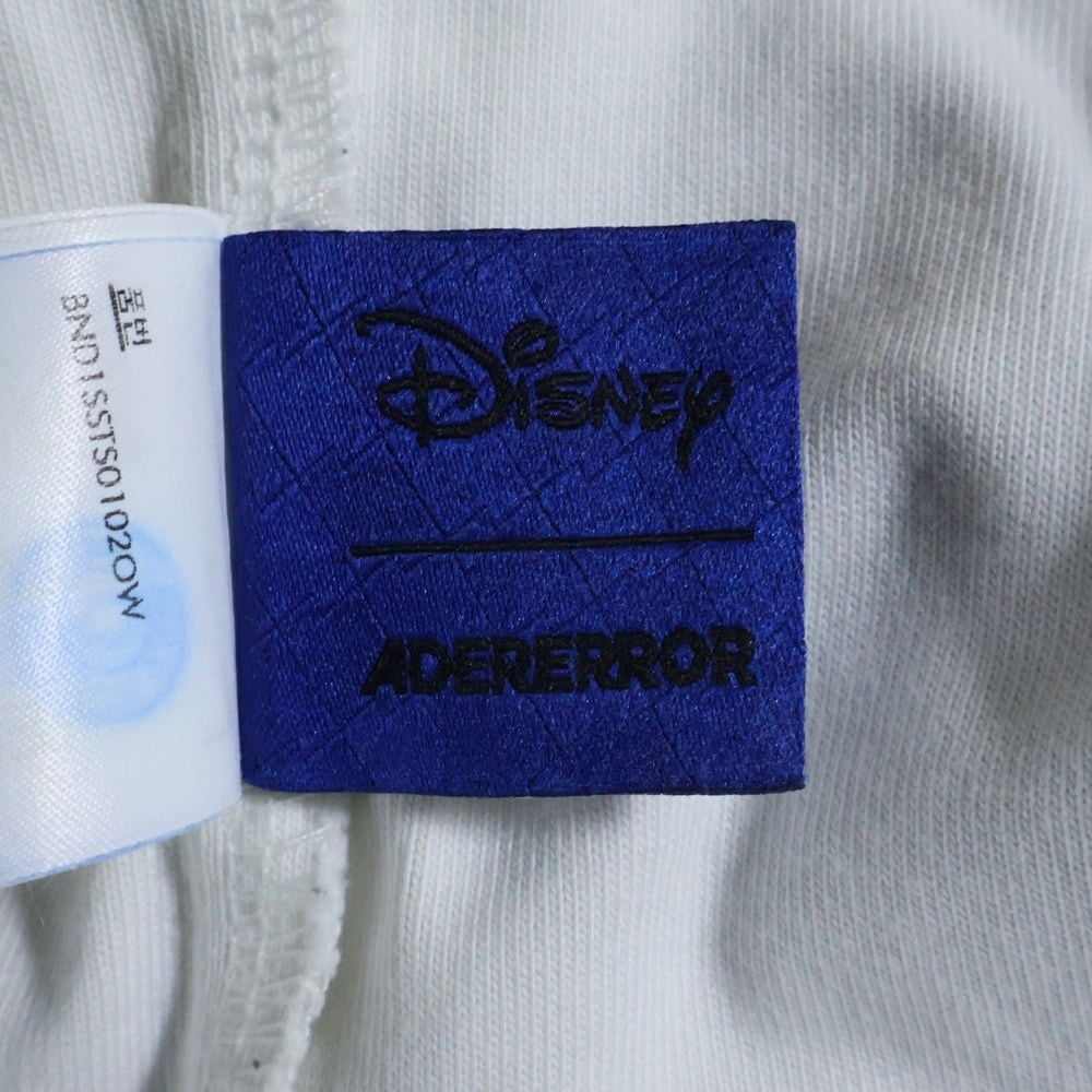 ADER ERROR(アーダーエラー) 24SS ×DISNEY Blue Easter Egg Graphic T-Shirt ディズニー ブルーイースターエッグ グラフィック 半袖Tシャツ ホワイト/マルチ BND1SSTS0102OW
