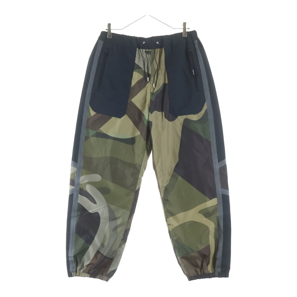 Sacai(サカイ) 21AW ×Kaws Trak Pants カウズ カモフラ トラックパンツ ブラック/カーキ 21-02568M