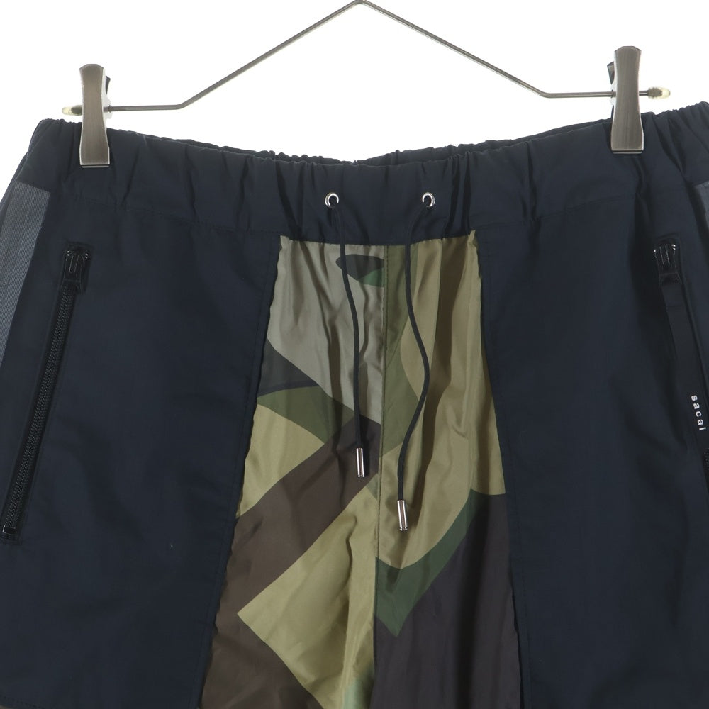 Sacai(サカイ) 21AW ×Kaws Trak Pants カウズ カモフラ トラックパンツ ブラック/カーキ 21-02568M