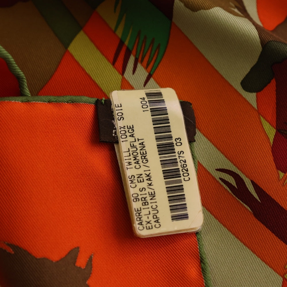 HERMES(エルメス) カレ90 EX LIBRIS EN CAMOUFLAGE エクスリブリスのカモフラージュ 総柄シルクスカーフ オレンジ レディース