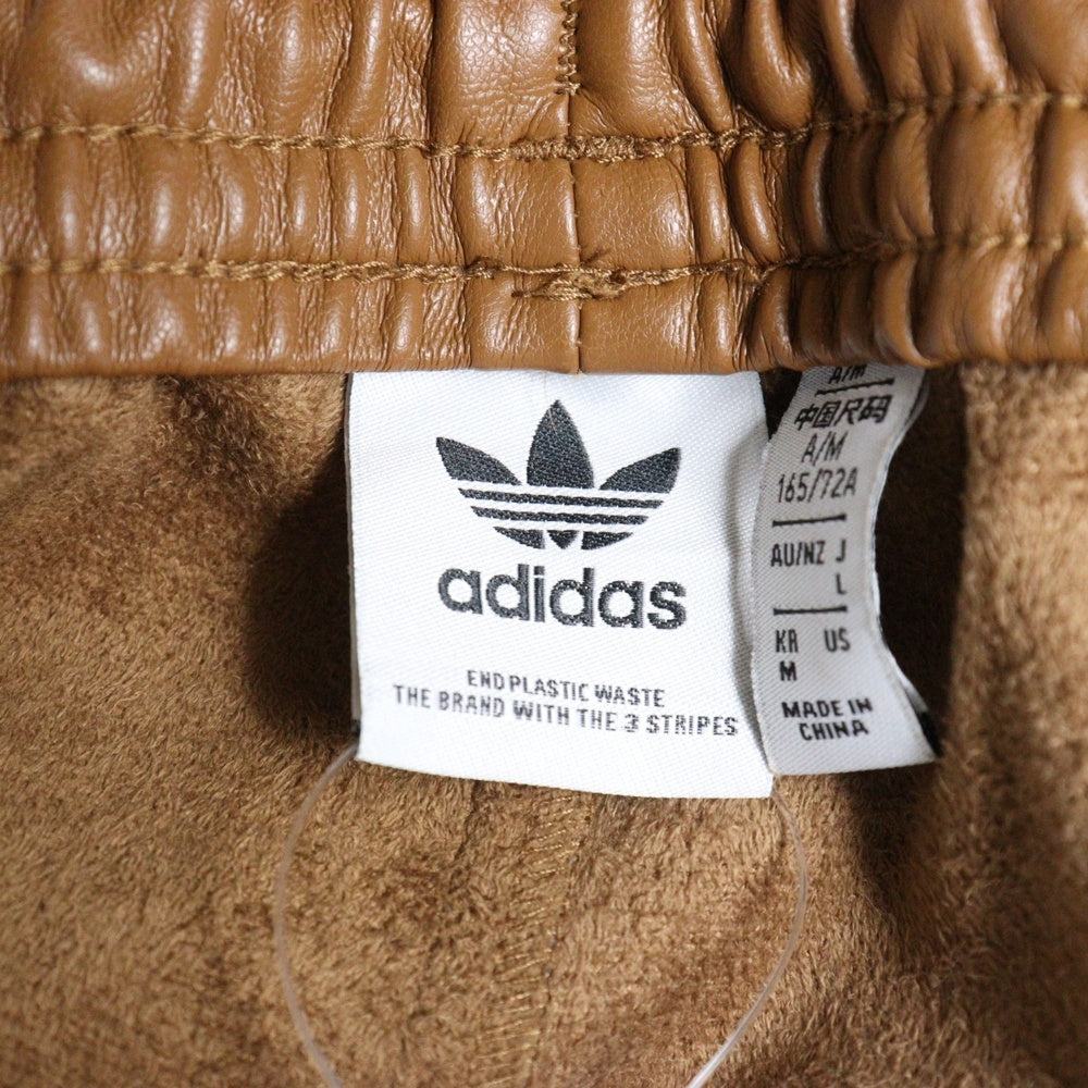 adidas(アディダス) アディブレイク フェイクレザー サイドスナップボタン トラックパンツ ブラウン II6098