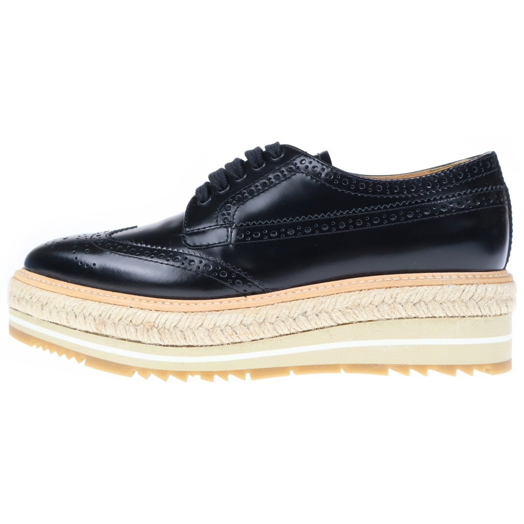 PRADA(プラダ) エスパドリーユ ウイングチップ メダリオン 厚底 レザー ローカット シューズ ブラック レディース