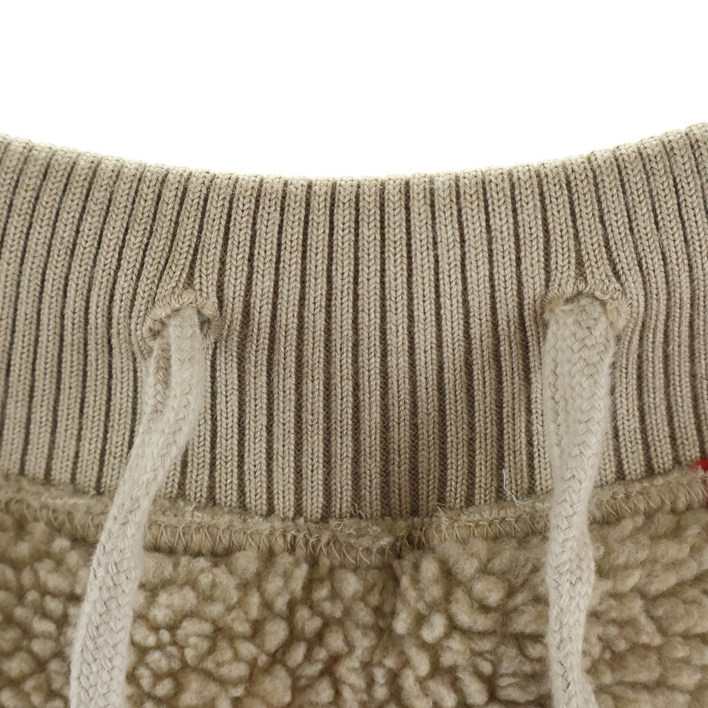 J.W.ANDERSON(ジェー ダブリュー アンダーソン) アップルモチーフ ボアフリース ジョガーパンツ ベージュ/レッド TR0262PG1139131
